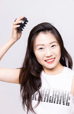 Woman holding growth applicator | folli products